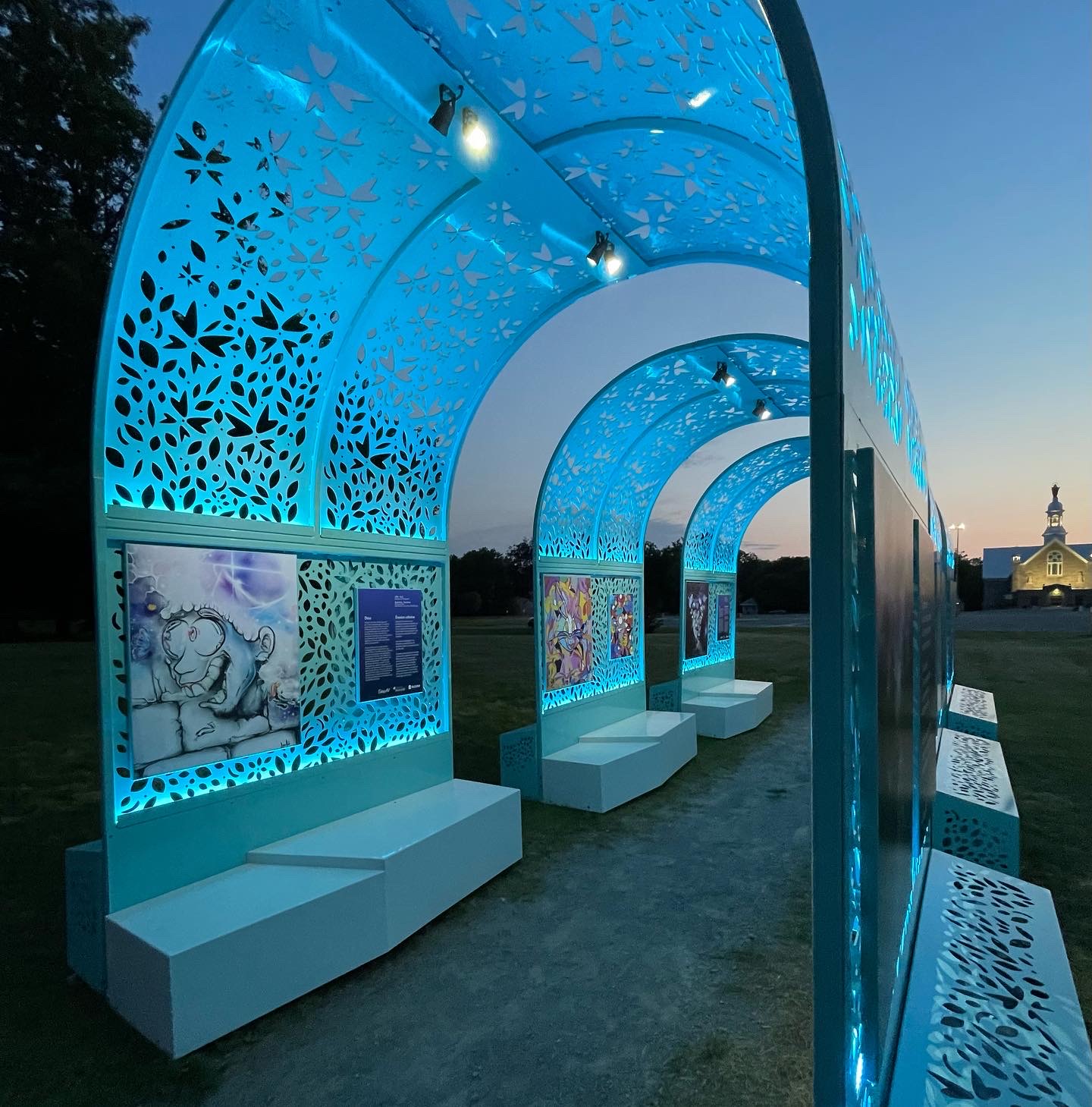 Illuminated lantern arches at dusk, Lanternes lumineuses